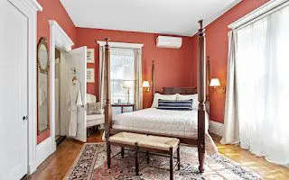 Ornate bed in vintage-style bedroom.